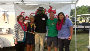 (From left to right) Mary Lott (a foster parent), Sally Buchanan (our founder & CEO), Tracy Joachim (a former foster parent), and Dale and Jessica Ozaki (the owners of Fish Tales)
